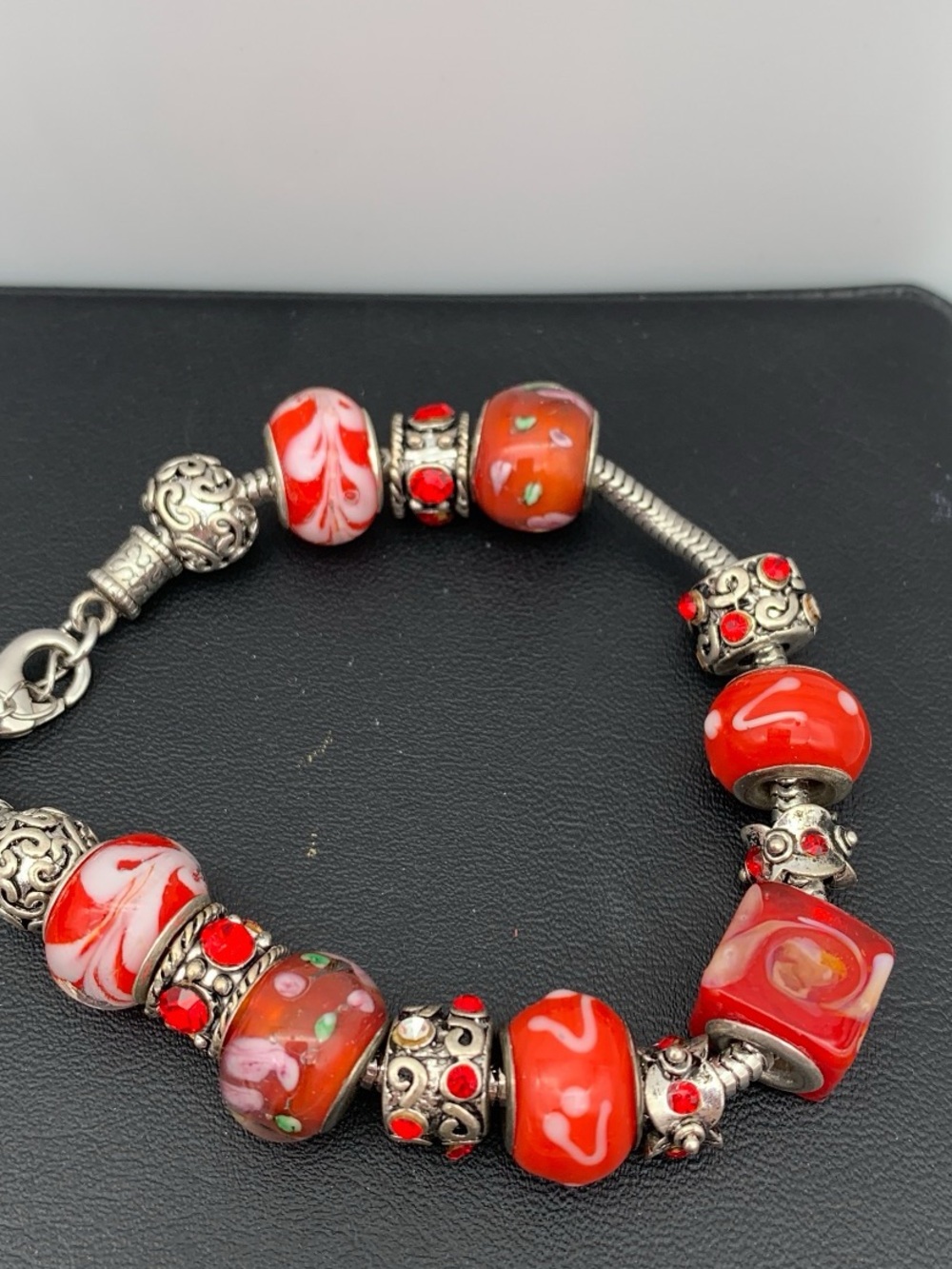 Silver tone and red Art Glass Charm Bracelet with red rhinestones